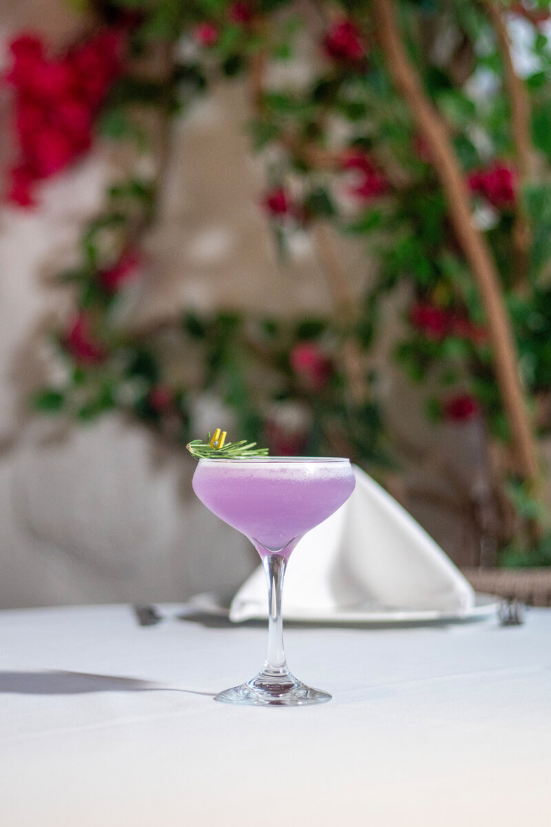 Purple cocktail on table